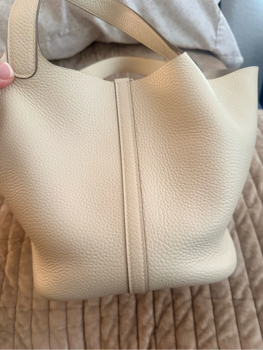 Leather bucket bag with charm